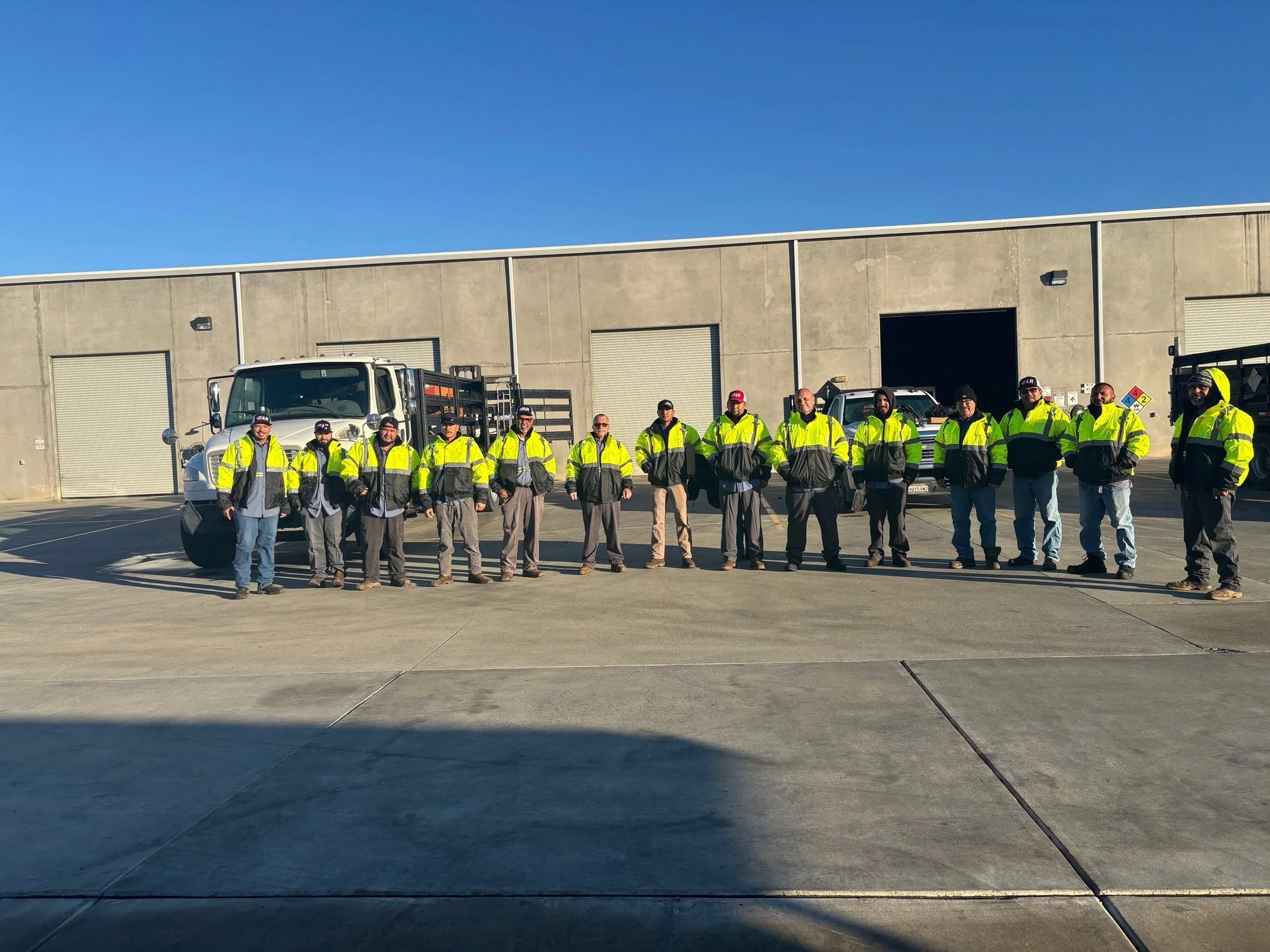 The GAR team in matching safety jackets outside the Reedley yard